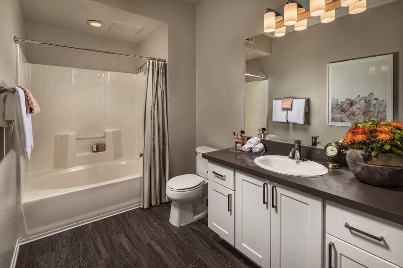 Bathroom with modern fixtures and elegant tile design at Colonnade Apartments