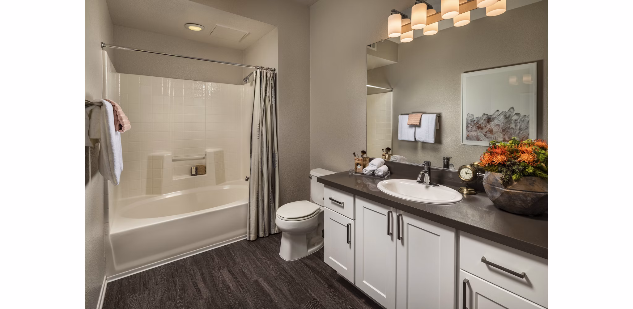 Bathroom with modern fixtures and elegant tile design at Colonnade Apartments