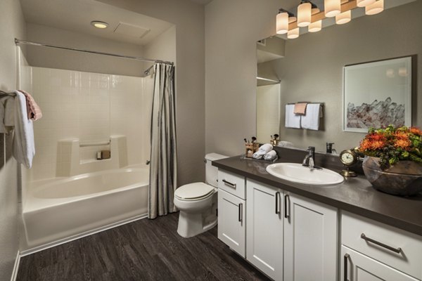 Bathroom with modern fixtures and elegant tile design at Colonnade Apartments