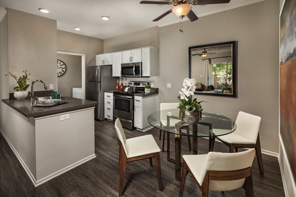 Dining area with modern decor and pendant lighting at Colonnade Apartments