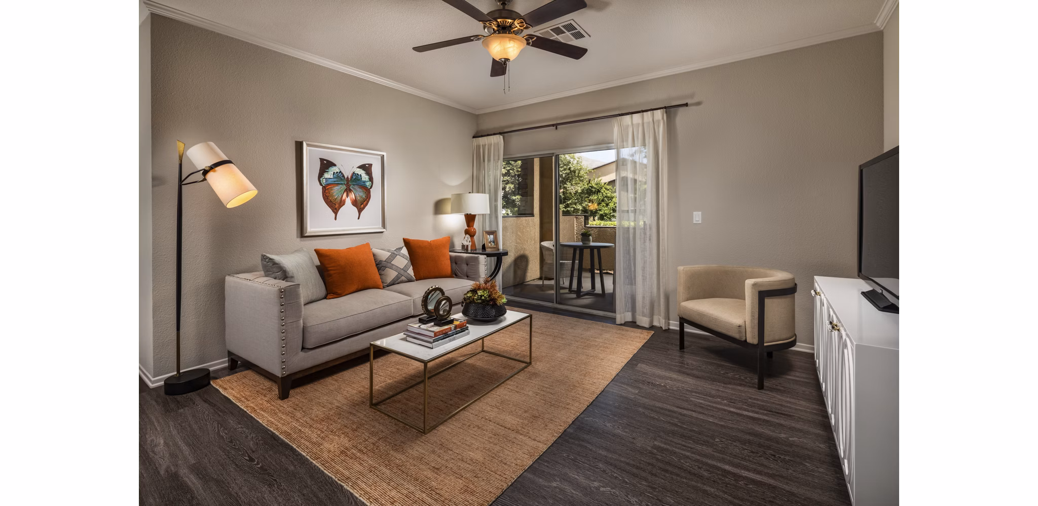 Spacious living room with modern decor in Colonnade Apartments, a Greystar luxury community