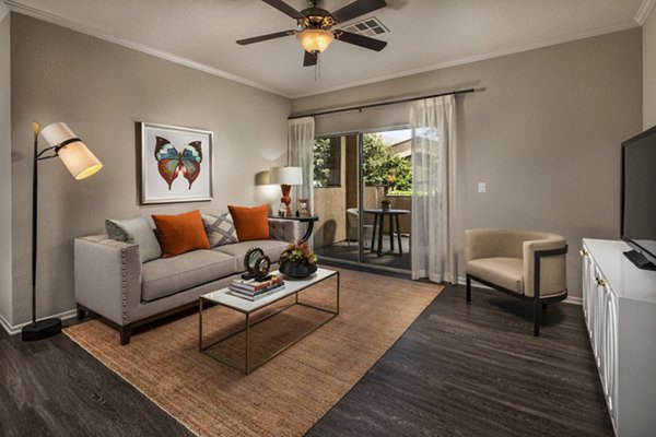 Spacious living room with modern decor in Colonnade Apartments, a Greystar luxury community