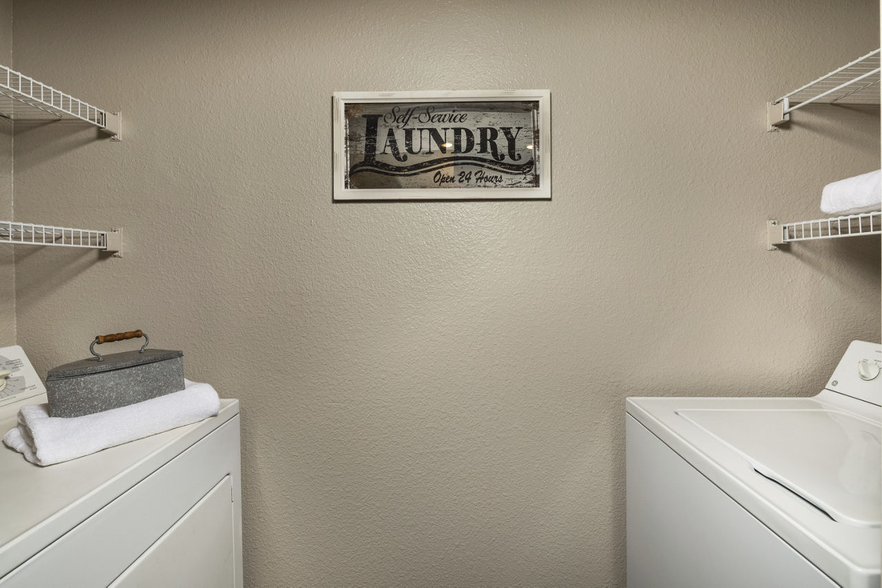 Laundry room at Colonnade Apartments