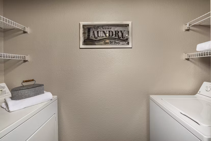 Laundry room with advanced appliances at Colonnade Apartments, a Greystar luxury community in a convenient urban location