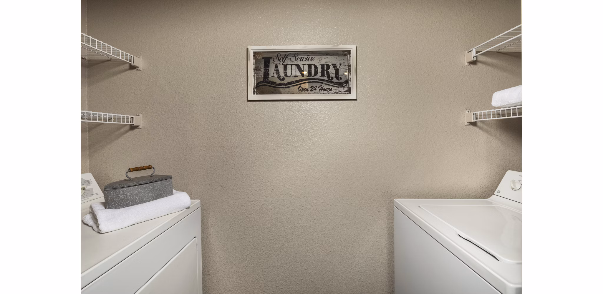 Laundry room with advanced appliances at Colonnade Apartments, a Greystar luxury community in a convenient urban location