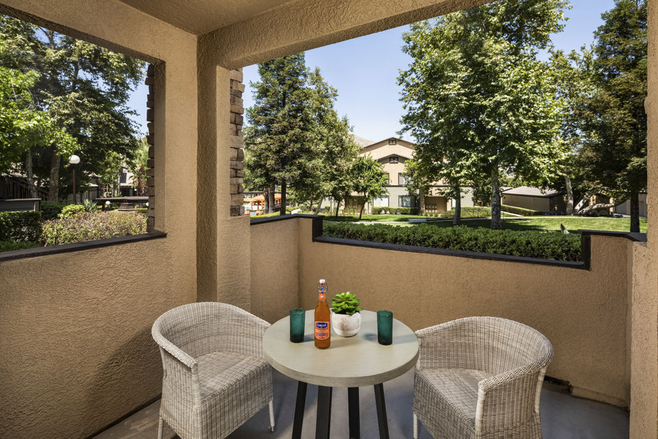 Patio with modern outdoor seating at Colonnade Apartments