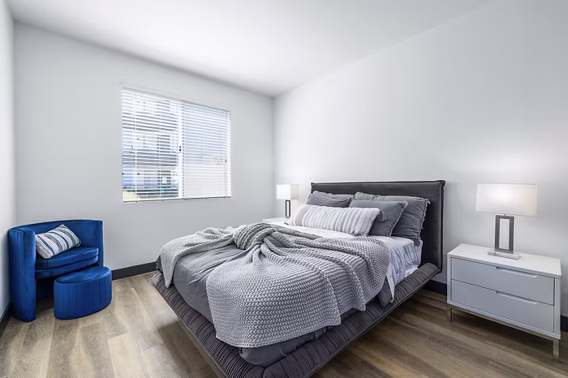 Cozy bedroom with modern decor at Enclave Apartments