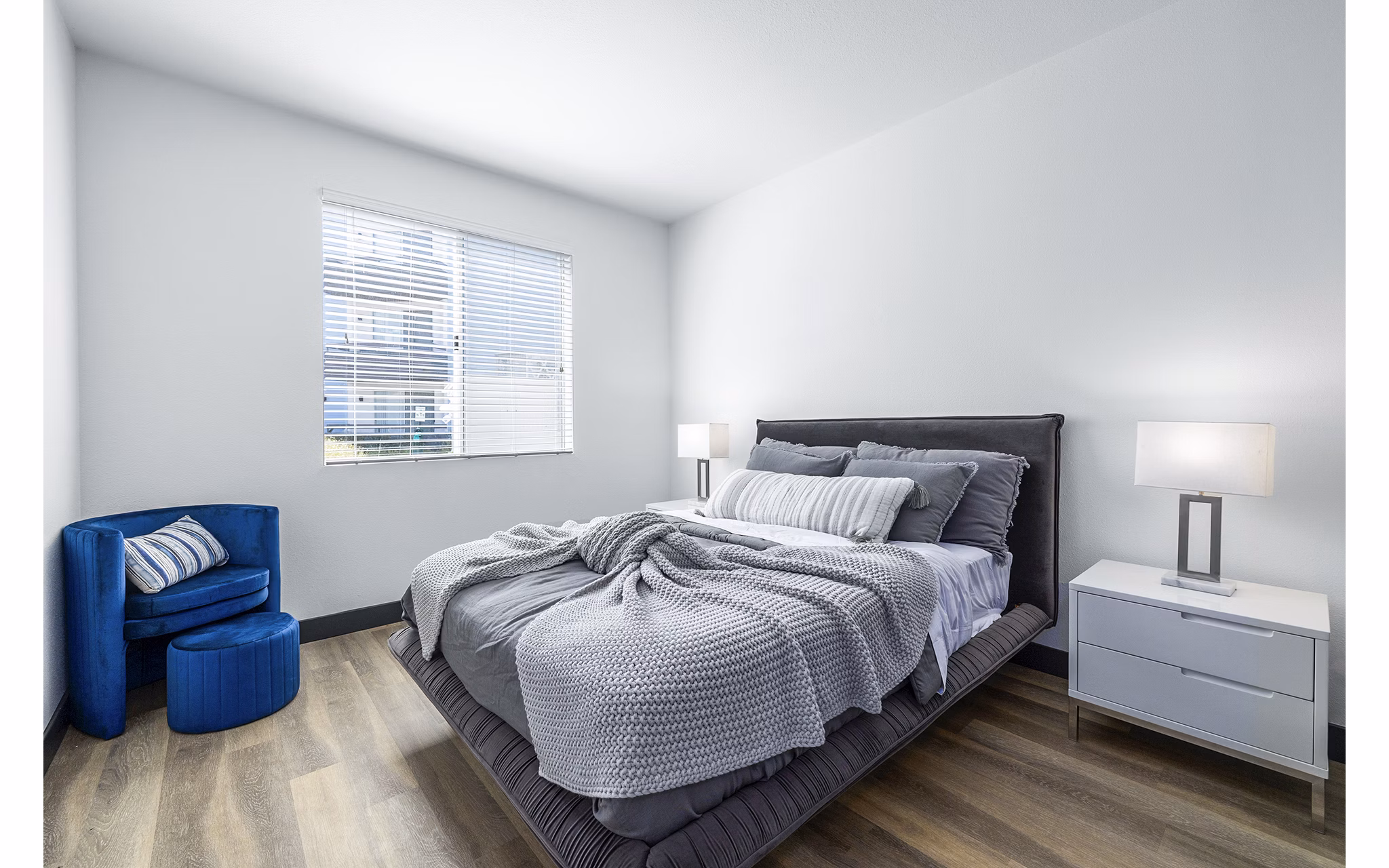 Cozy bedroom with modern decor at Enclave Apartments