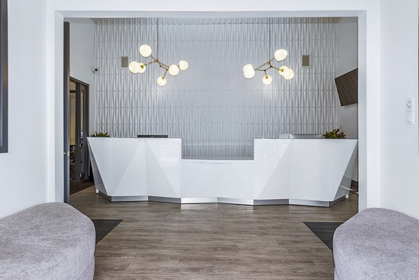 Clubhouse featuring modern design and comfortable seating at Enclave Apartments