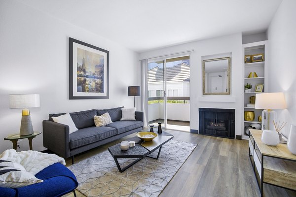 Spacious living room with modern furnishings in Enclave Apartments