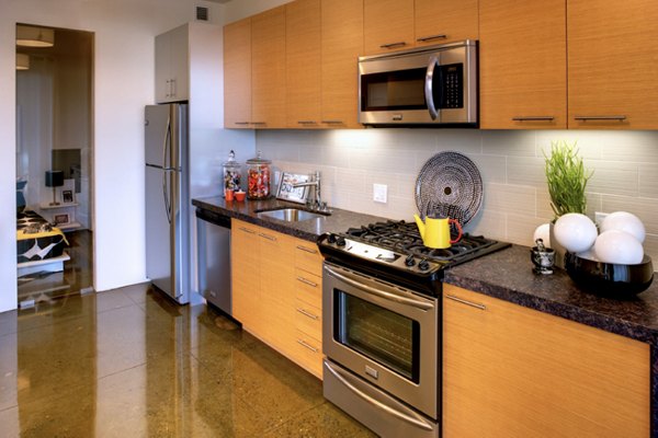 Modern kitchen with stainless steel appliances at Potrero Launch Apartments, ideal for luxury living in the heart of the city