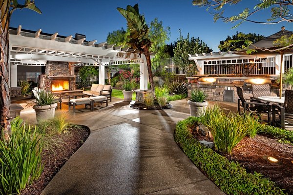 Grill and patio area at Channel Point Apartments with modern outdoor seating