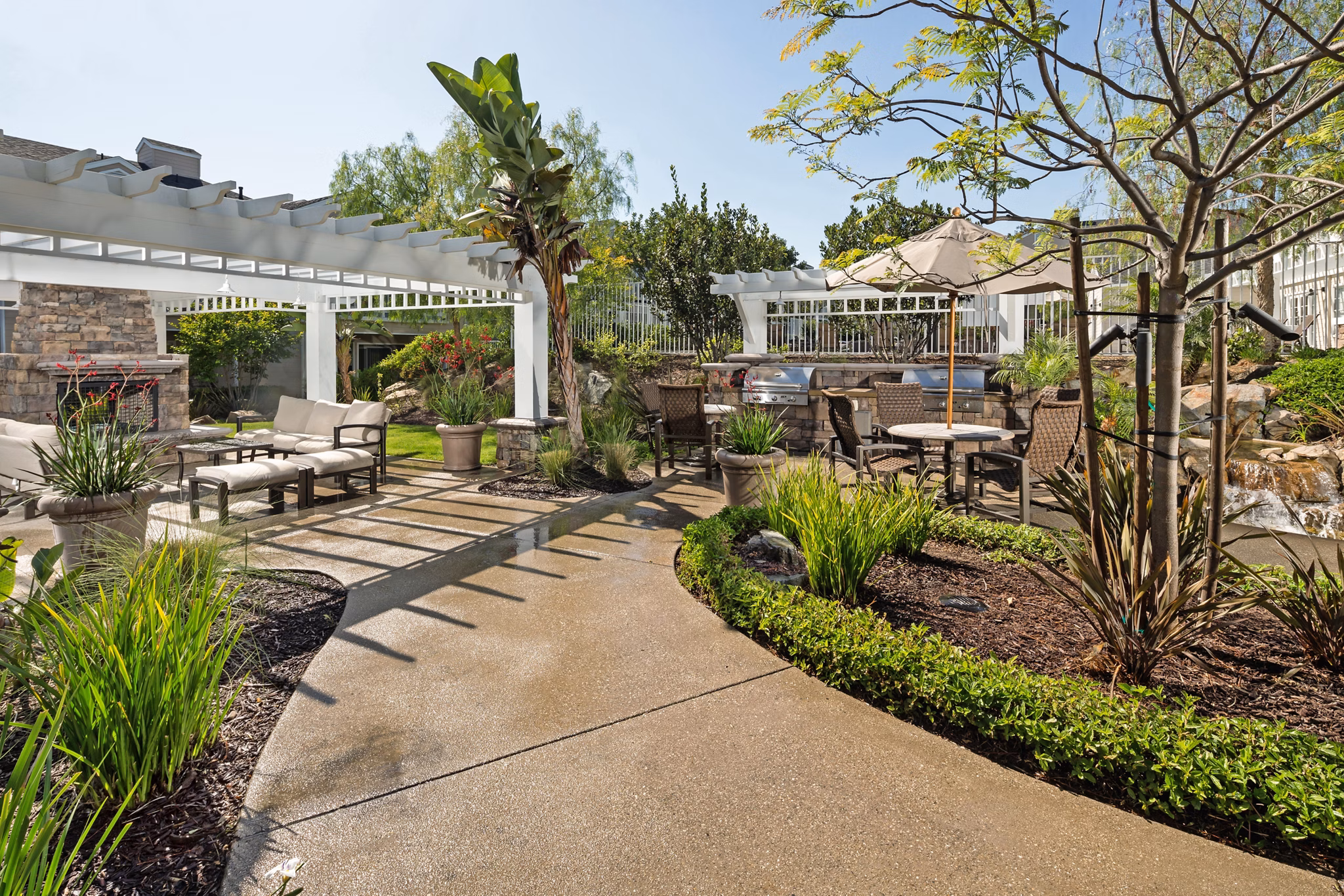 Grill area with modern patio furniture at Channel Point Apartments offering luxury outdoor dining experience