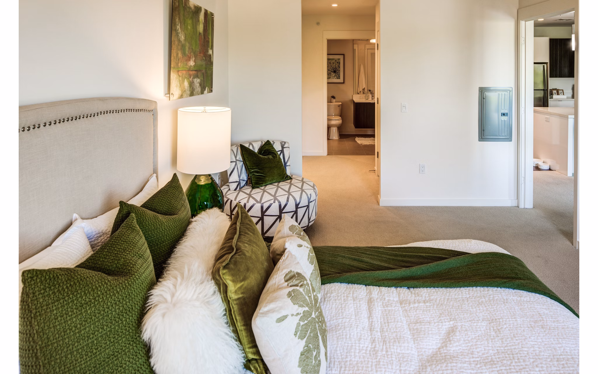 Modern bedroom with stylish decor and large windows at The Dudley Apartments
