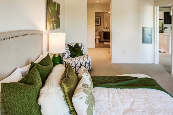 Modern bedroom with stylish decor and large windows at The Dudley Apartments