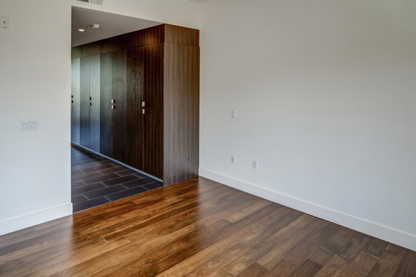Cozy bedroom featuring modern design elements at The Dudley Apartments, a luxury living option by Greystar in the heart of the city