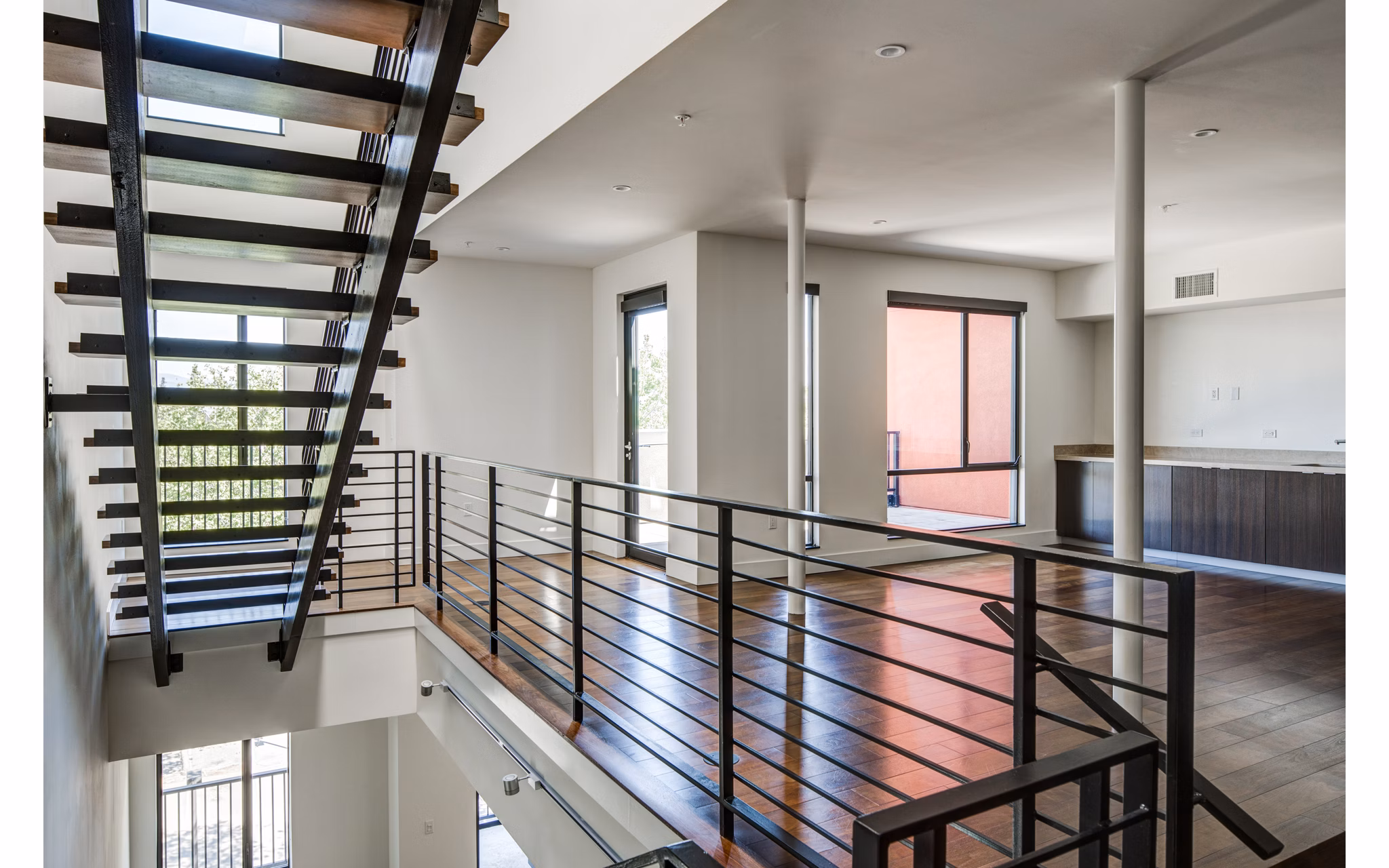 Clubhouse featuring modern design and cozy seating at The Dudley Apartments luxury community