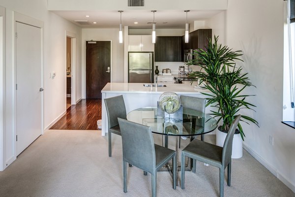 Dining area with modern furnishings at The Dudley Apartments luxury property