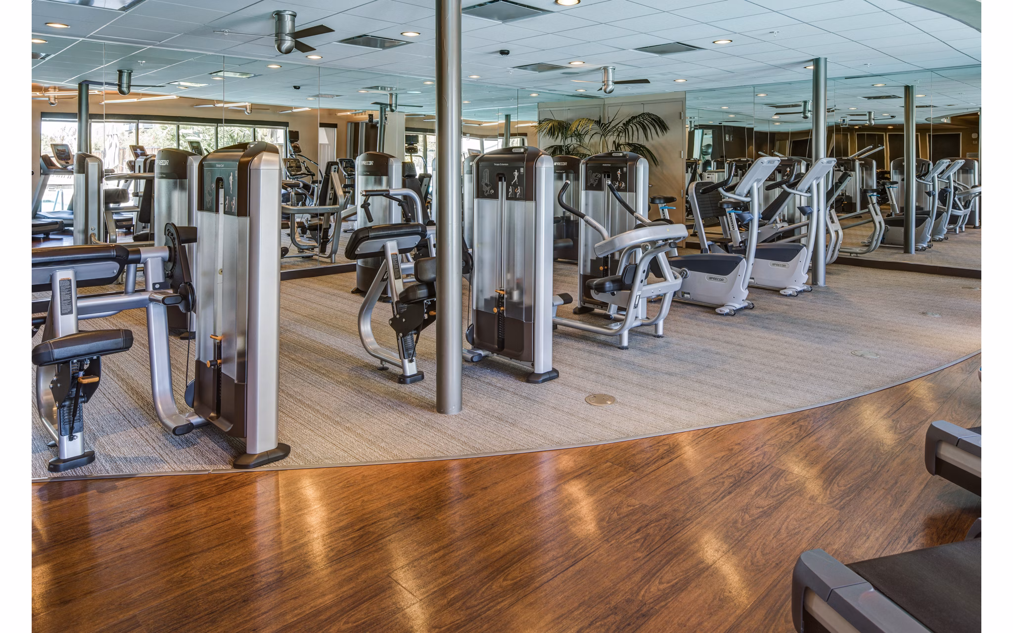 State-of-the-art fitness center featuring modern equipment at The Dudley Apartments