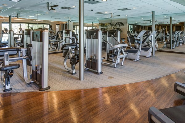 State-of-the-art fitness center featuring modern equipment at The Dudley Apartments