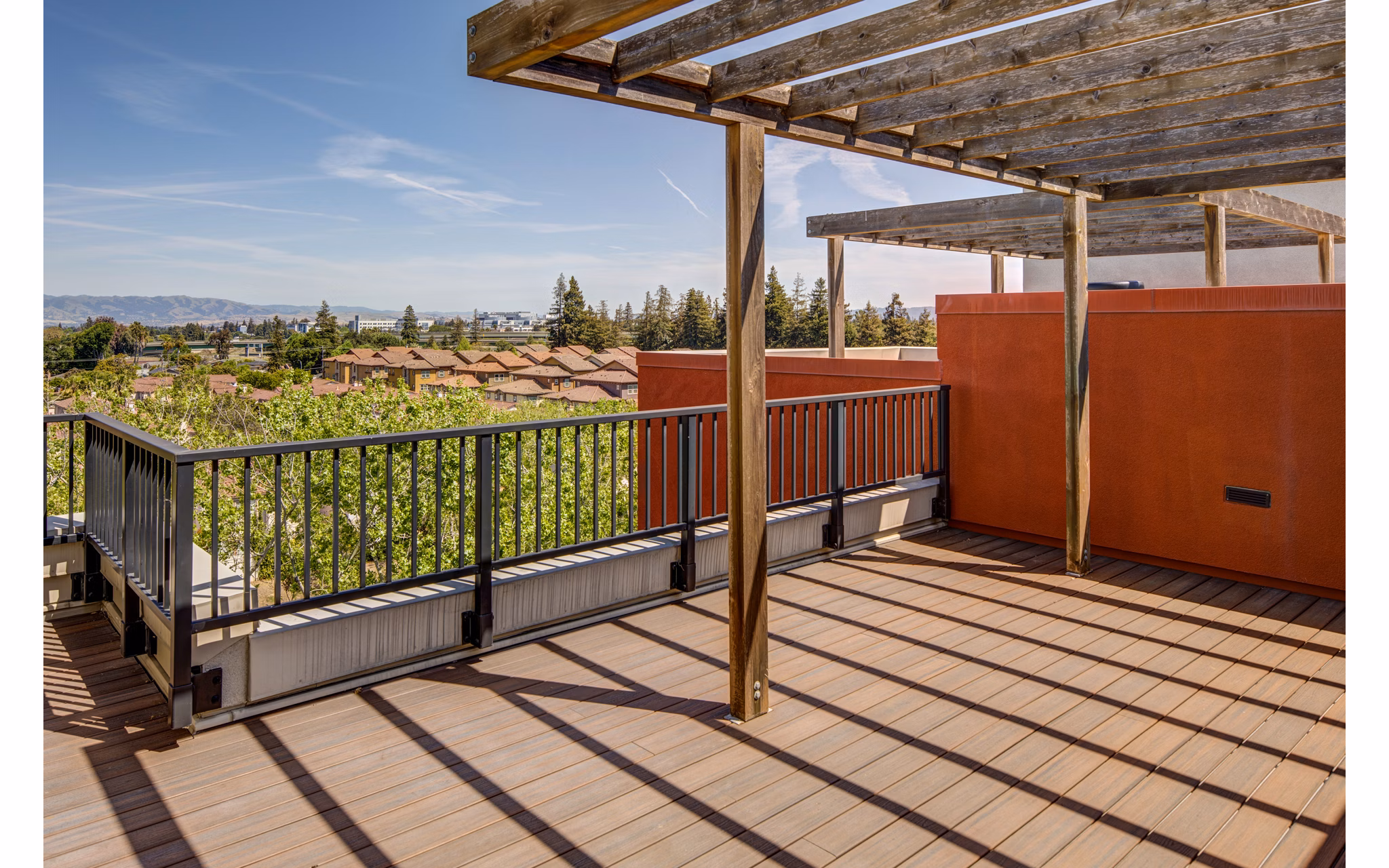 Stylish patio with cozy seating at The Dudley Apartments, offering outdoor relaxation in a luxury community setting