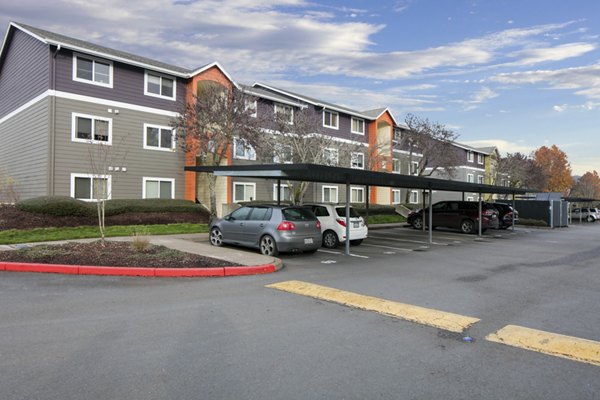 Creekside Apartments: Serene luxury apartment complex with lush landscaping in suburban setting