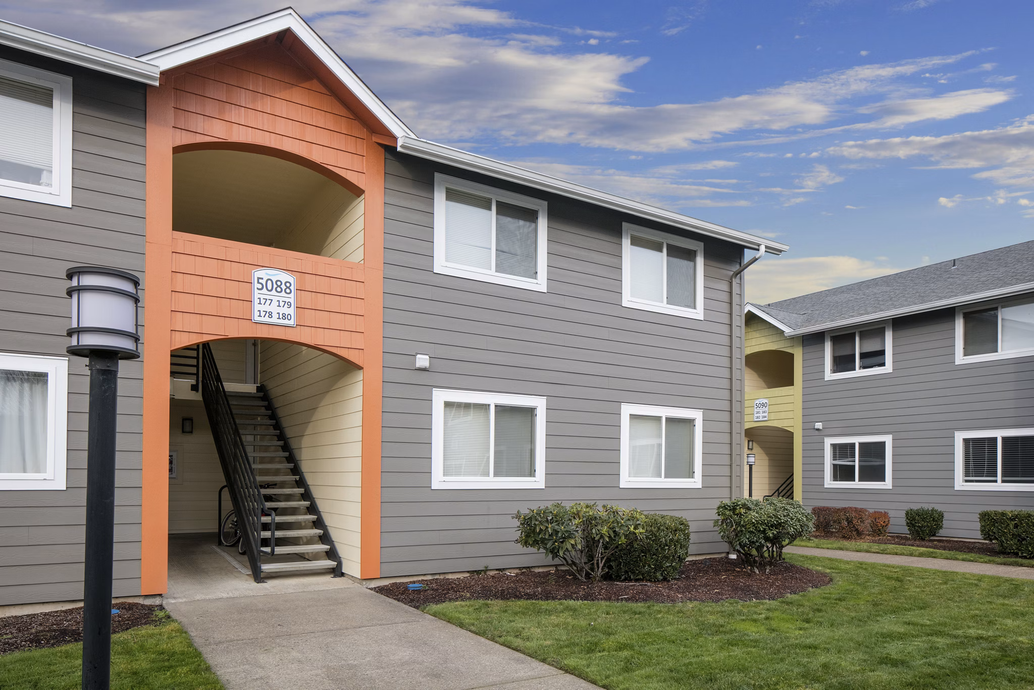 Creekside Apartments: Scenic view of luxury apartments nestled in a serene environment