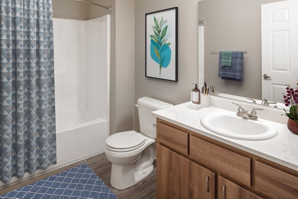 Luxury modern bathroom featuring sleek fixtures at Creekside Apartments