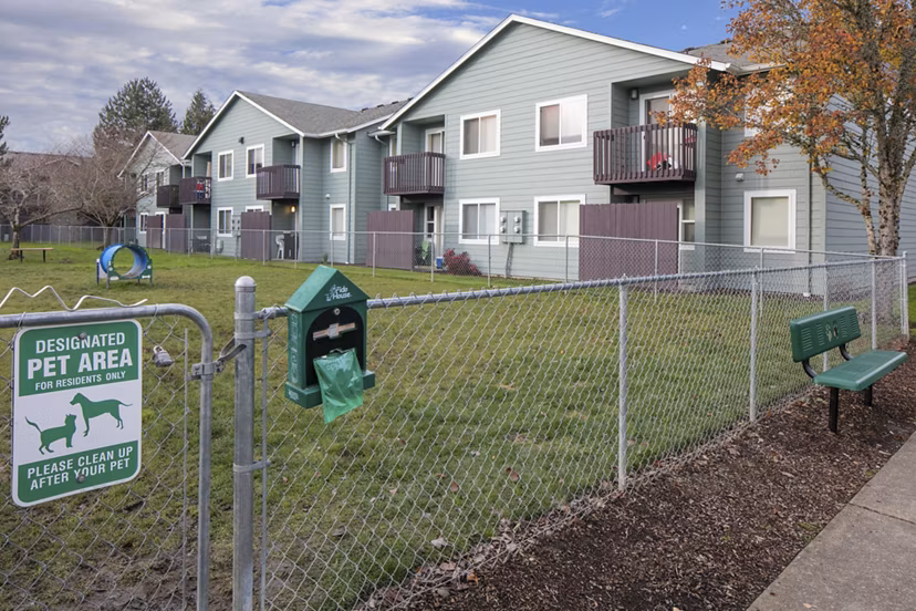 On-site dog park at Creekside Apartments, offering spacious play area and agility equipment for residents' pets