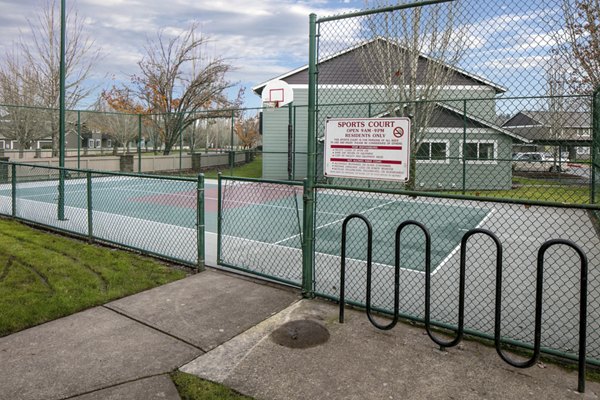 Sport court with basketball hoops at Creekside Apartments