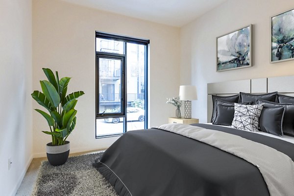 Elegant bedroom with modern decor at Levare Apartments, Greystar luxury apartments in a serene Seattle neighborhood