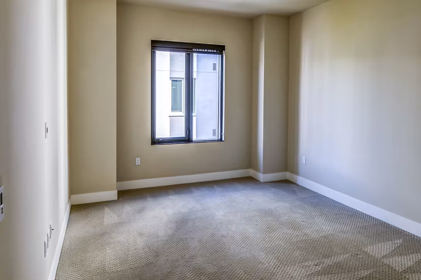 Cozy bedroom with modern decor in Levare Apartments, luxury living by Greystar