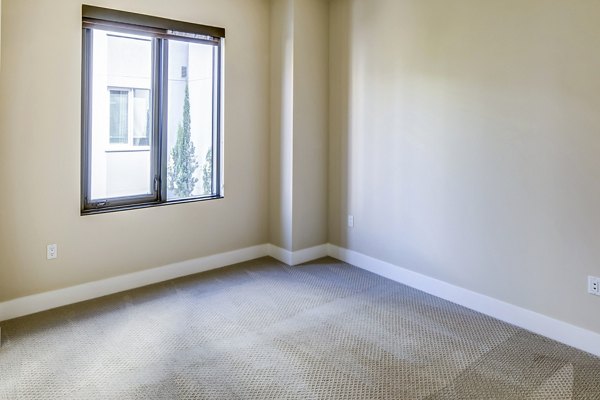 Cozy bedroom with modern decor at Levare Apartments â€“ luxury living in Greystar's premium community