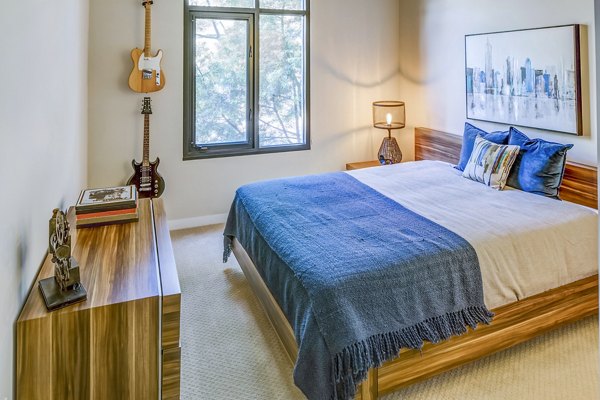 Cozy bedroom with modern decor in Levare Apartments