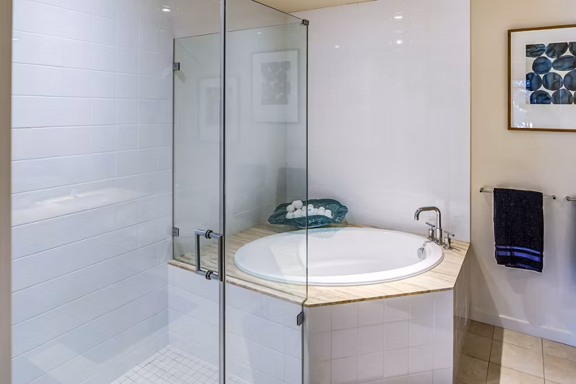 Modern bathroom with granite countertops and dual sinks at Levare Apartments in Greystar luxury community