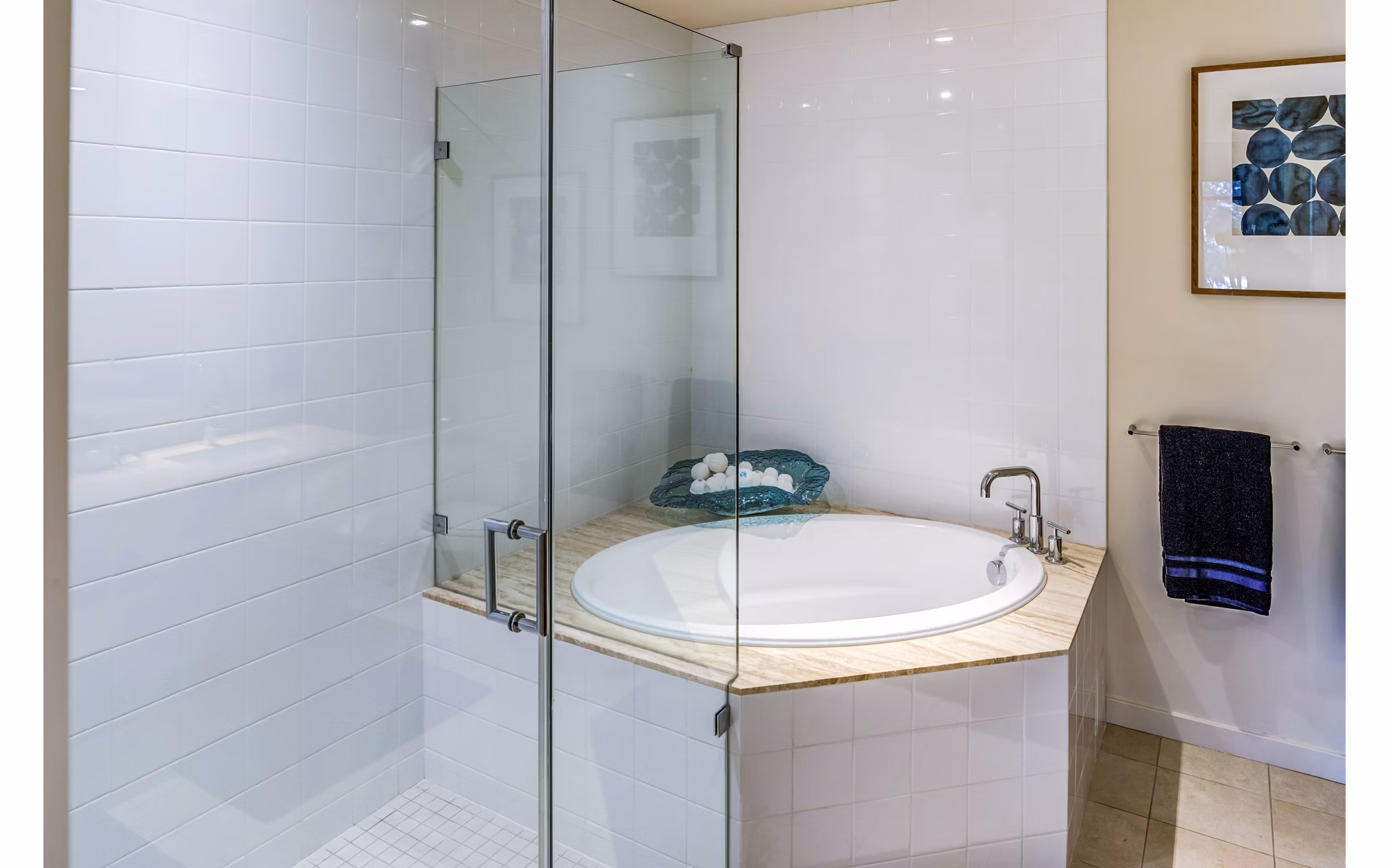 Modern bathroom with granite countertops and dual sinks at Levare Apartments in Greystar luxury community