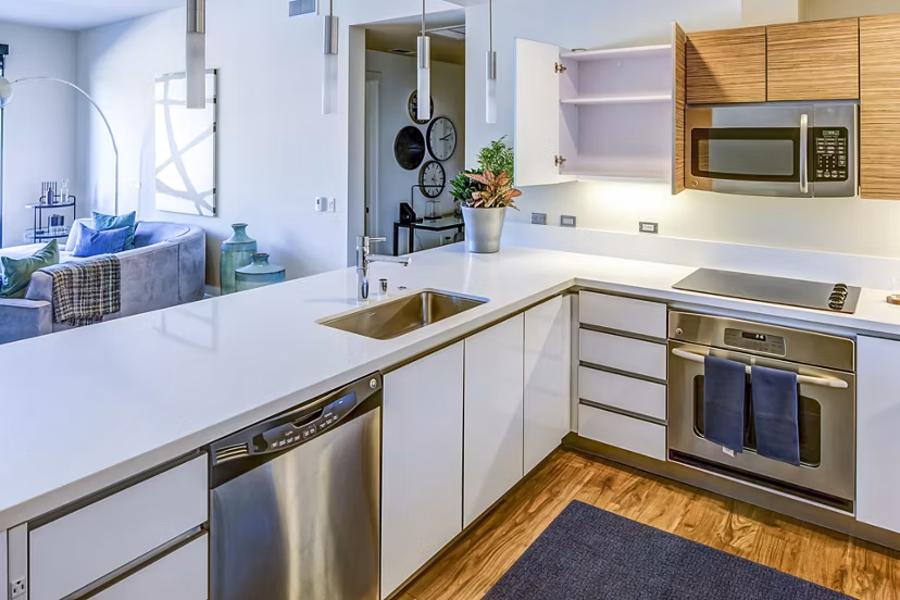 Modern kitchen with stainless steel appliances at Levare Apartments, luxury living in style