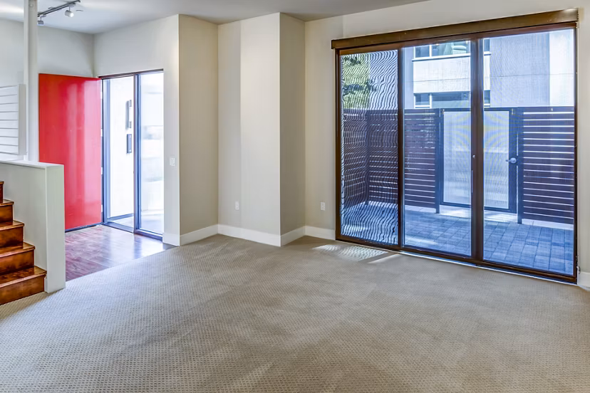 Stylish living room with modern furnishings in Levare Apartments, featuring spacious layout and abundant natural light
