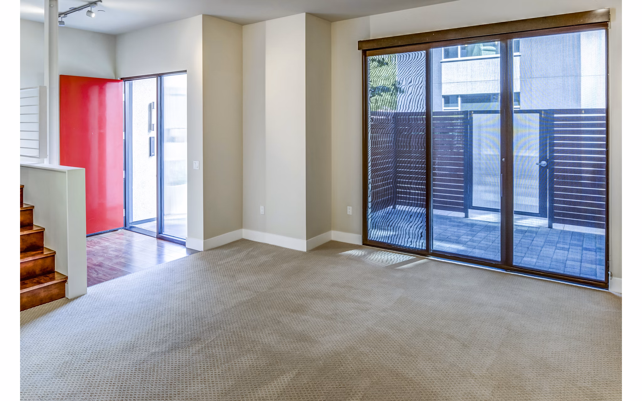 Stylish living room with modern furnishings in Levare Apartments, featuring spacious layout and abundant natural light