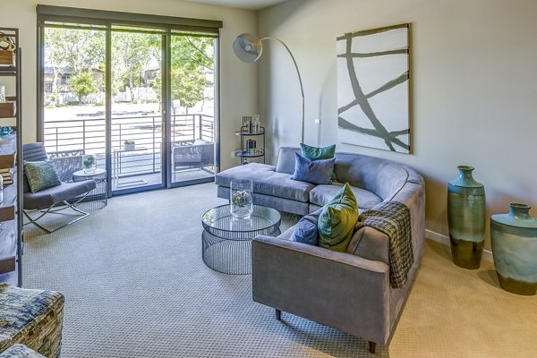 Spacious living room with modern decor in Levare Apartments