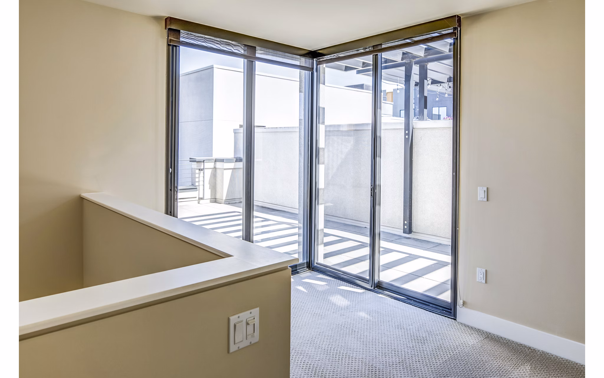 Spacious outdoor patio with modern seating at Levare Apartments, ideal for relaxation and entertaining in a luxury apartment community