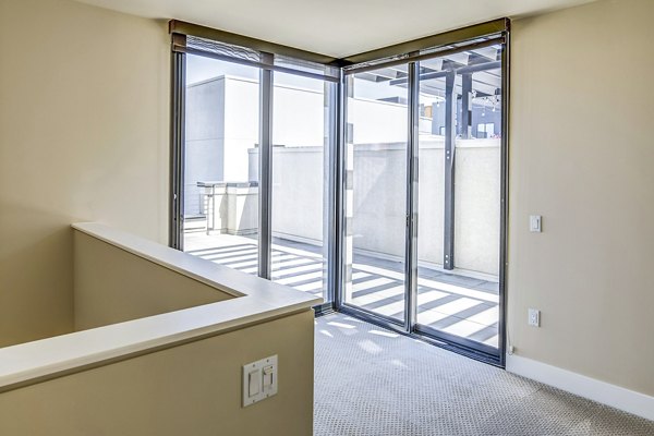 Spacious outdoor patio with modern seating at Levare Apartments, ideal for relaxation and entertaining in a luxury apartment community