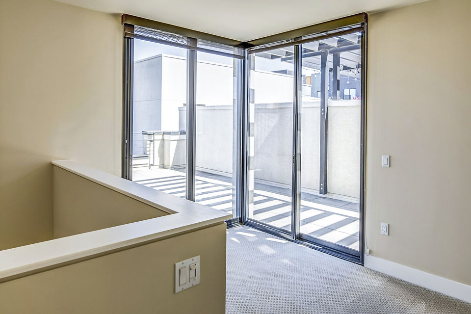 Spacious outdoor patio with modern seating at Levare Apartments, ideal for relaxation and entertaining in a luxury apartment community