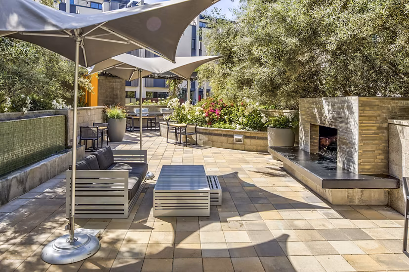 Fire pit on a stylish patio at Levare Apartments offering luxury living