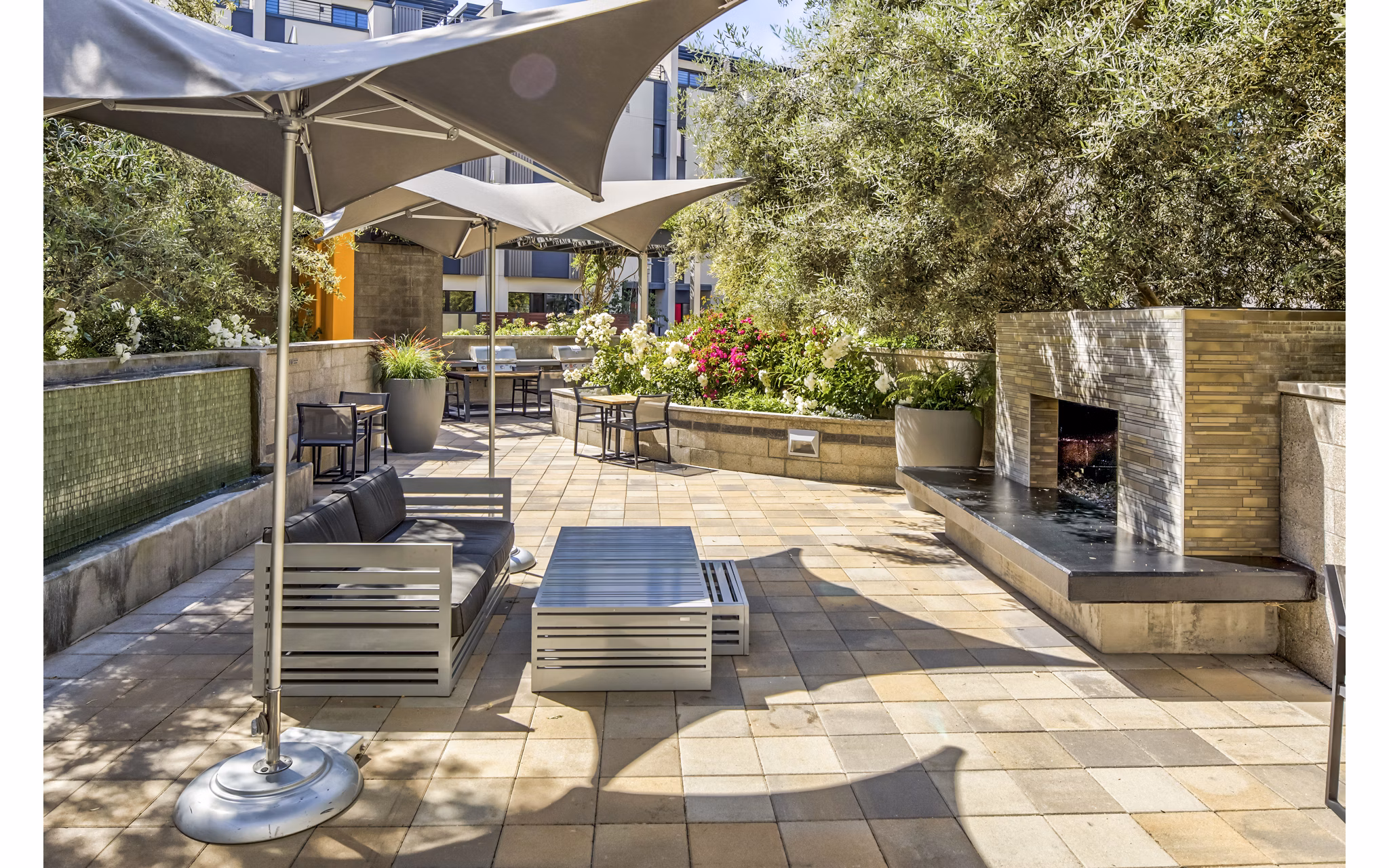 Fire pit on a stylish patio at Levare Apartments offering luxury living
