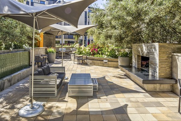 Fire pit on a stylish patio at Levare Apartments offering luxury living