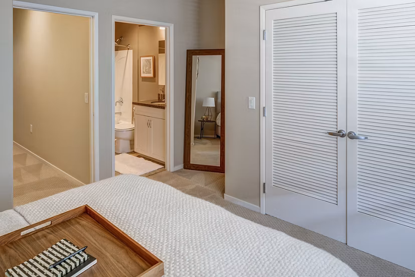 Cozy bedroom with elegant decor in Santana Row Apartments, a Greystar luxury property