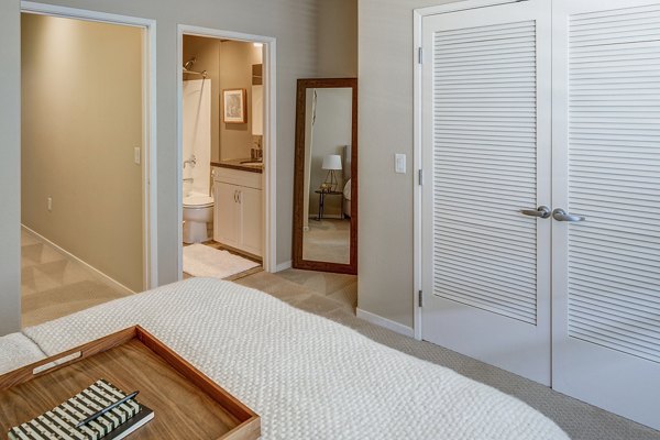 Cozy bedroom with elegant decor in Santana Row Apartments, a Greystar luxury property
