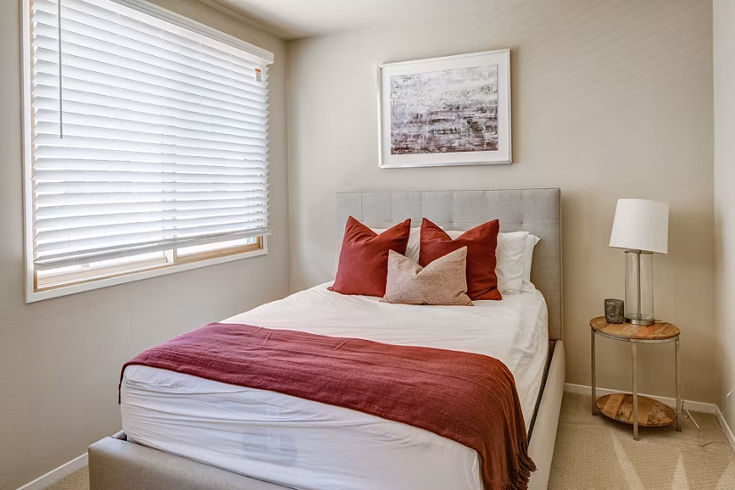 Bedroom featuring luxurious decor and modern furnishings at Santana Row Apartments