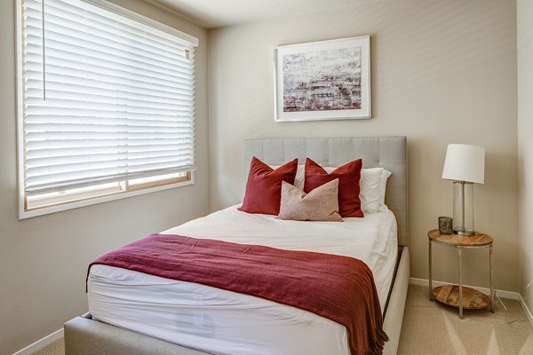 Bedroom featuring luxurious decor and modern furnishings at Santana Row Apartments